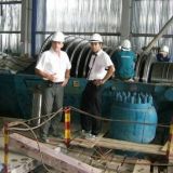 checking turbine installation progress. Uong Bi power plant, Vietnam