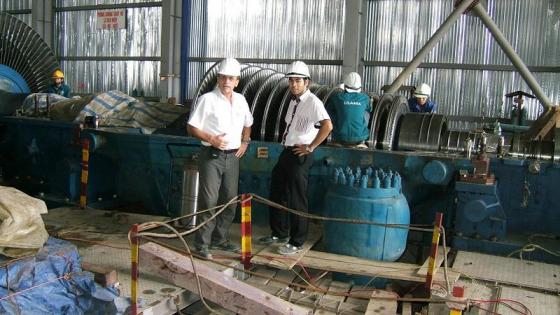 checking turbine installation progress. Uong Bi power plant, Vietnam