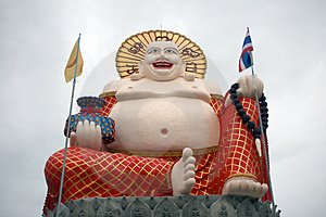Hymyilevä vaurauden Buddha Thaimaassa