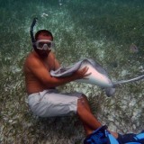 Tour guide hugging a stingray @Ambergris Caye, Belize
