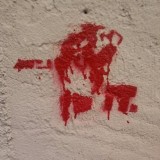 Graffitti erään Pohjois-Italialaisen talon seinässä.